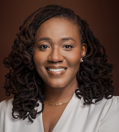 Anastasia Orakwue DDS MHS Professional Dentist Headshot – Smile Worth Dental Co Portrait of Anastasia Orakwue DDS MHS smiling in professional headshot representing expert dental care – Smile Worth Dental Co